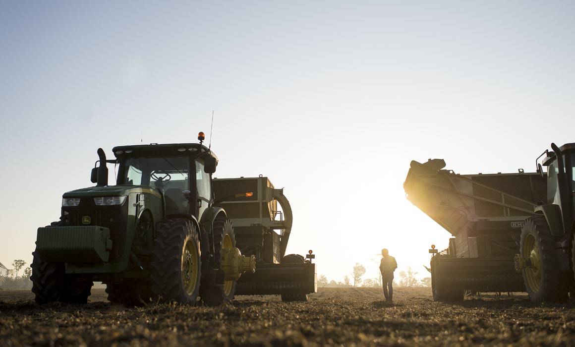two tractors in a field