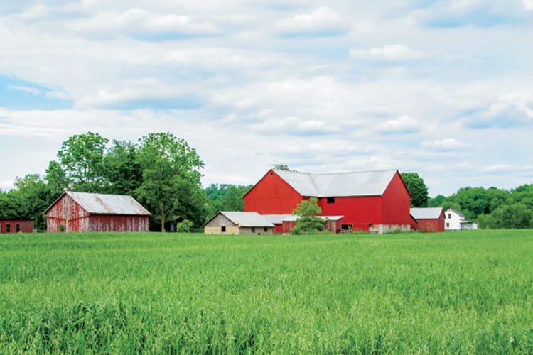 American farmland with red barn.