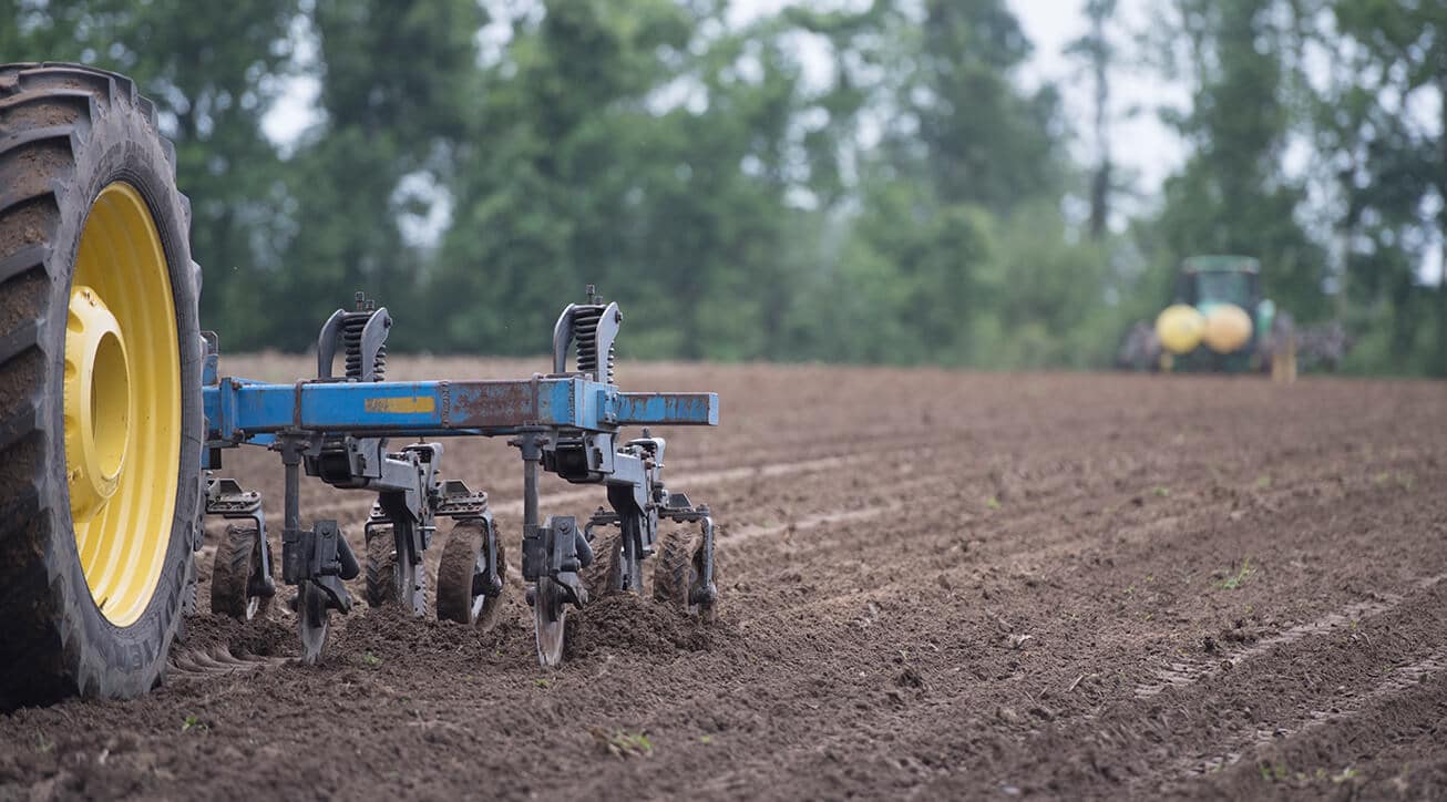 large tractor plowing a field