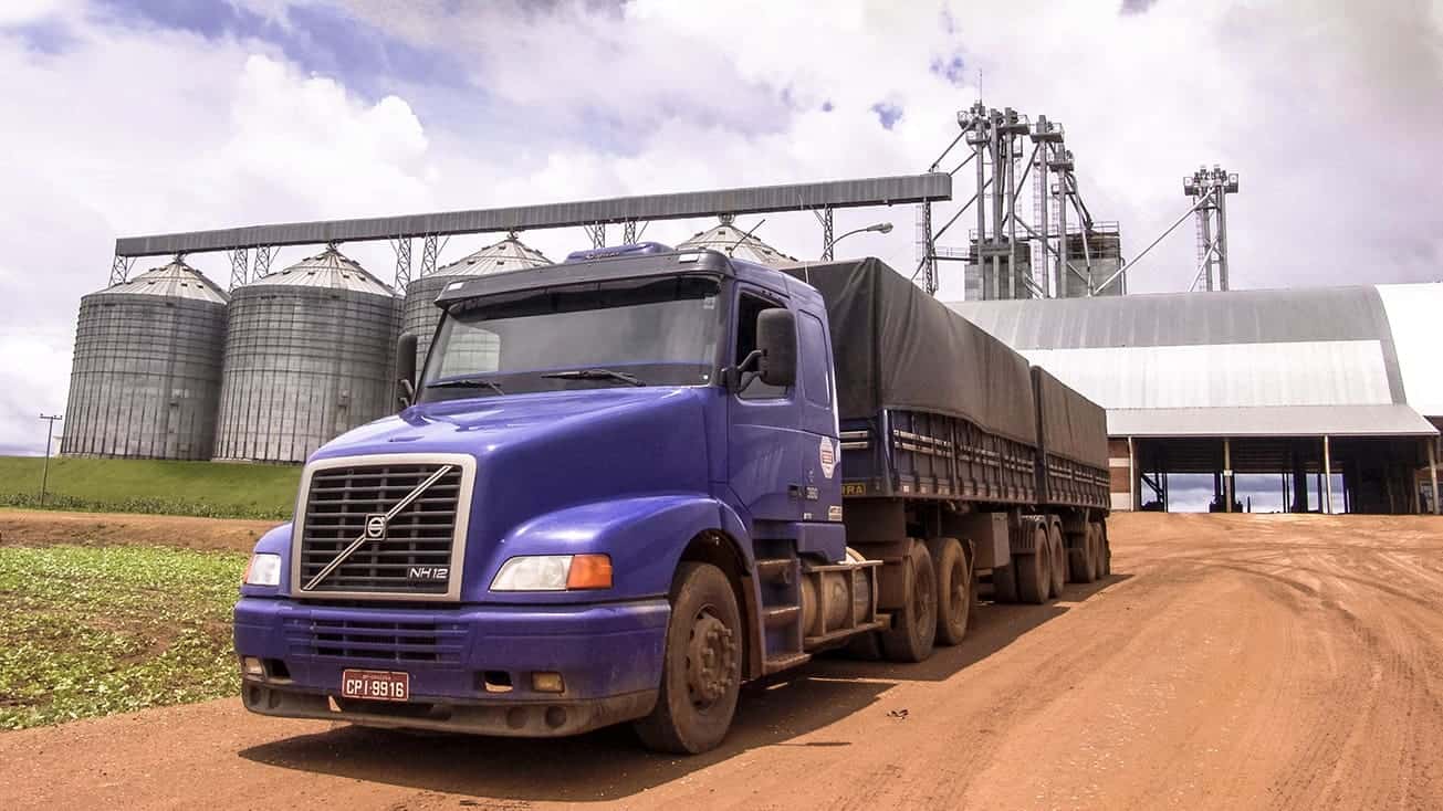 Truck moving grain at storage facility