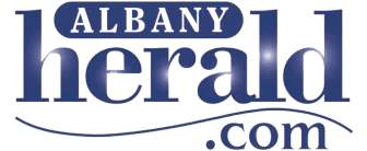 Logo of the Albany Herald, an online news website covering central banks and inflation.